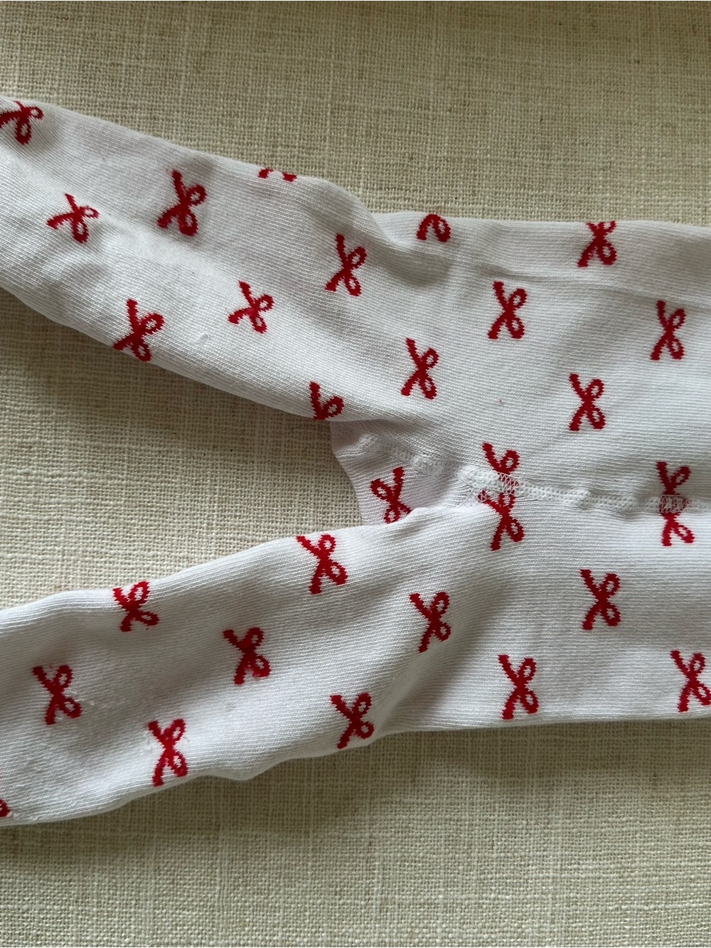 Rufflebutts White Baby/Toddler Footed Tights with Red Bow Pattern
